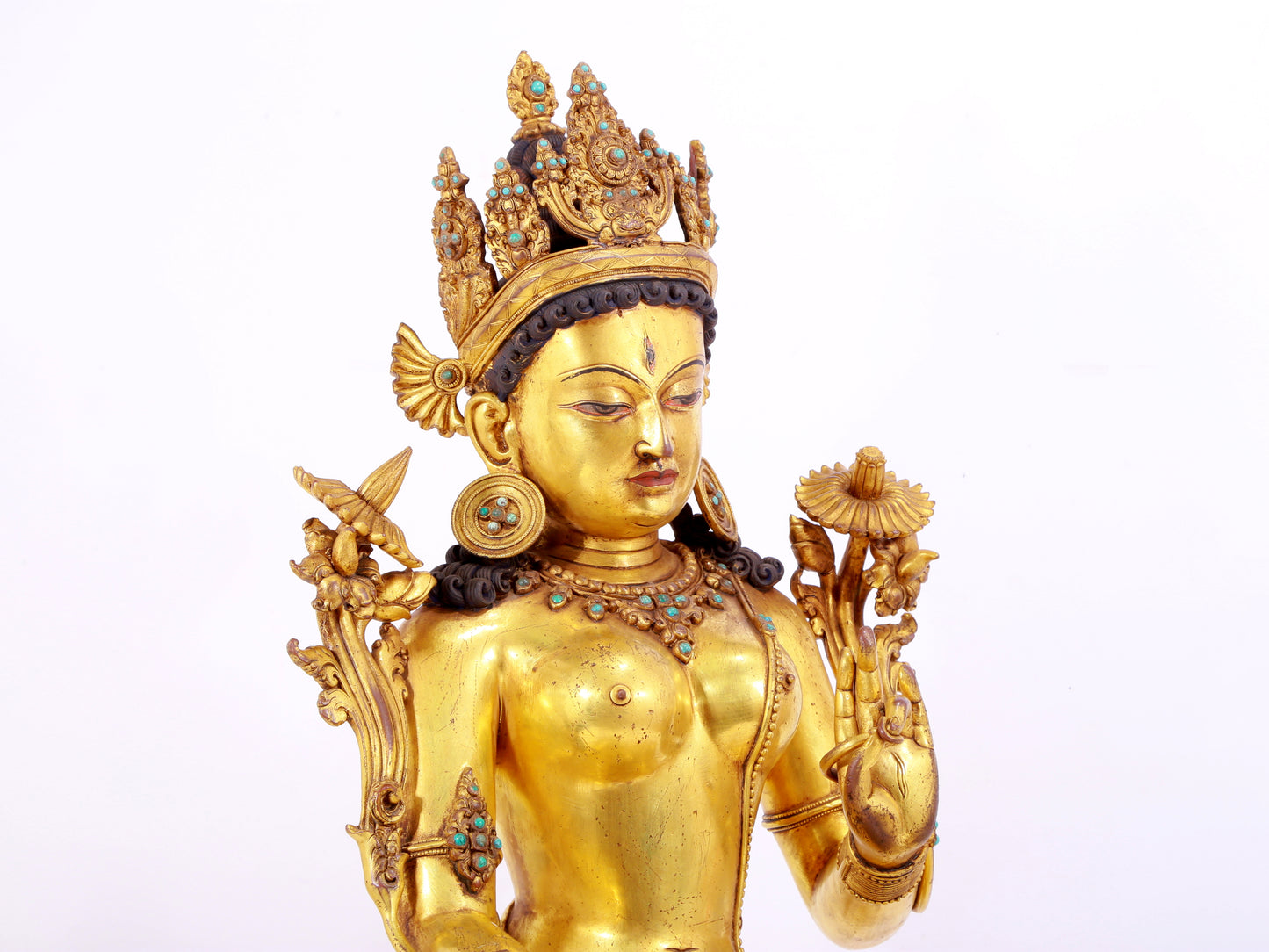 majestic gilt bronze statue of White Tara inlaid with turquoise