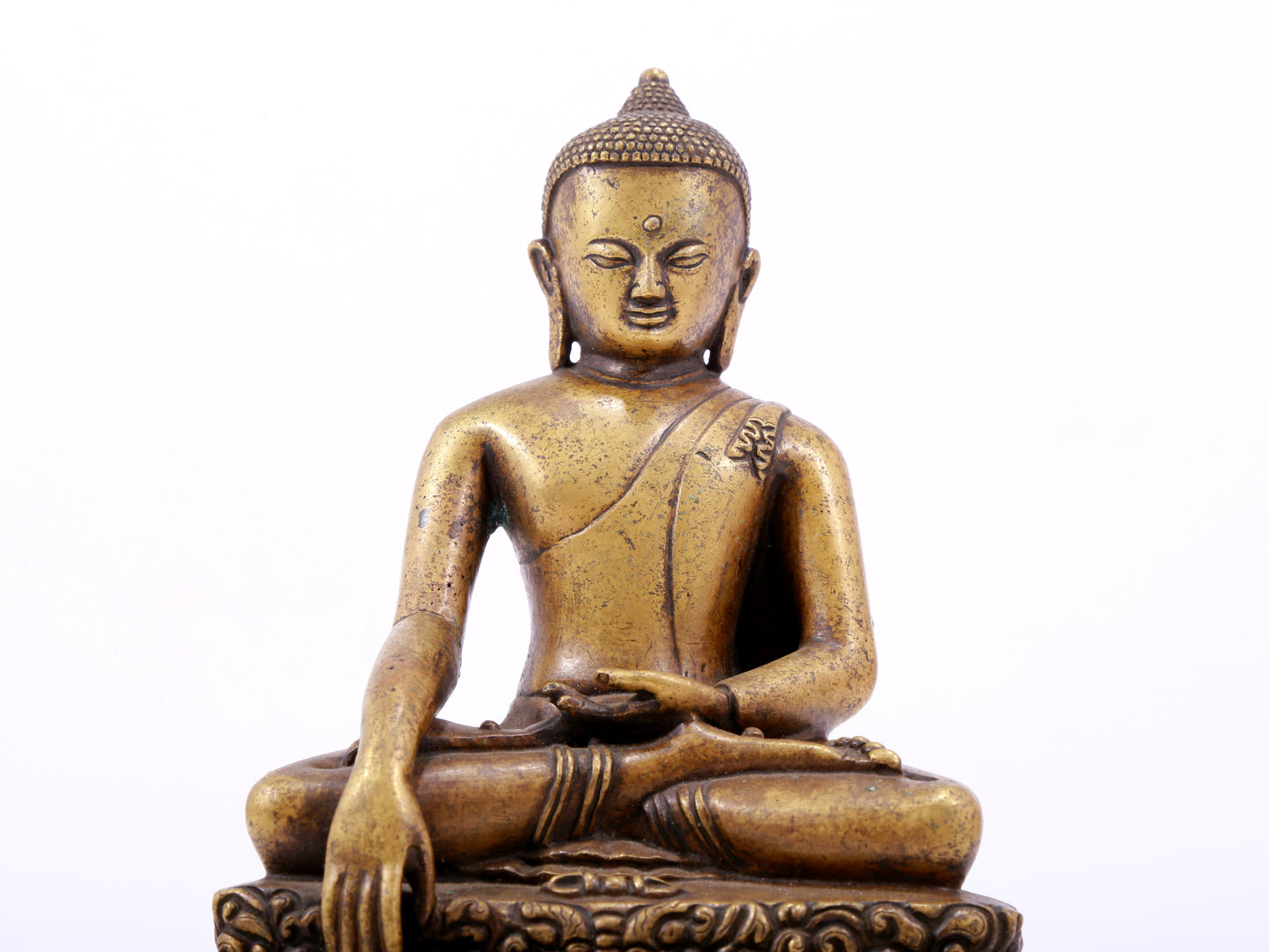 A solemn alloy copper statue of Gautama Buddha