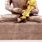 A solemn gilt bronze and silver figure inlaid with hundreds of treasures