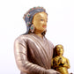 A solemn gilt bronze and silver figure inlaid with hundreds of treasures