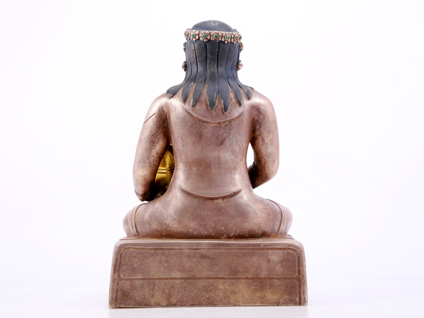 A solemn gilt bronze and silver figure inlaid with hundreds of treasures