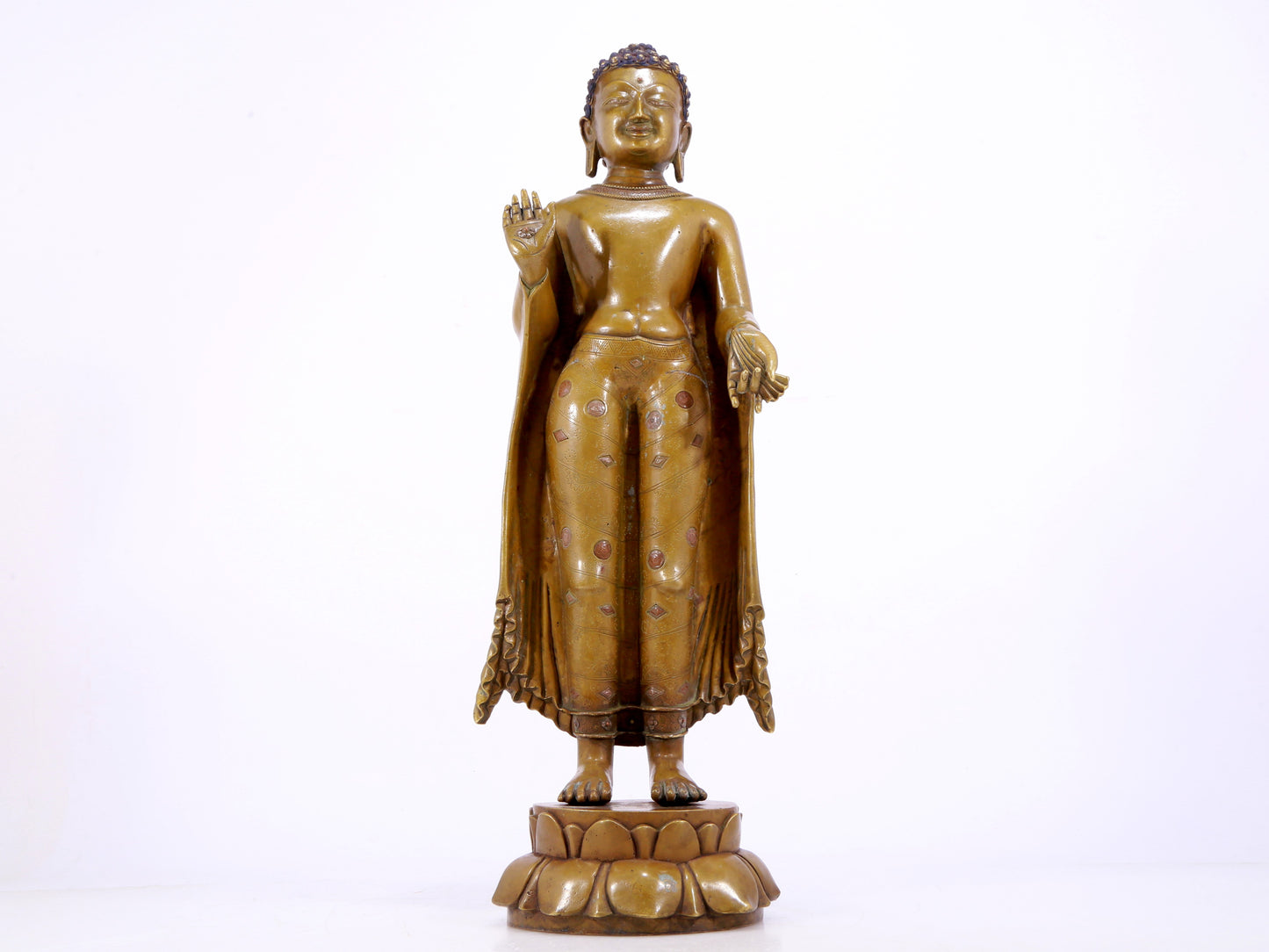 A solemn alloy copper inlaid silver statue of Gautama Buddha