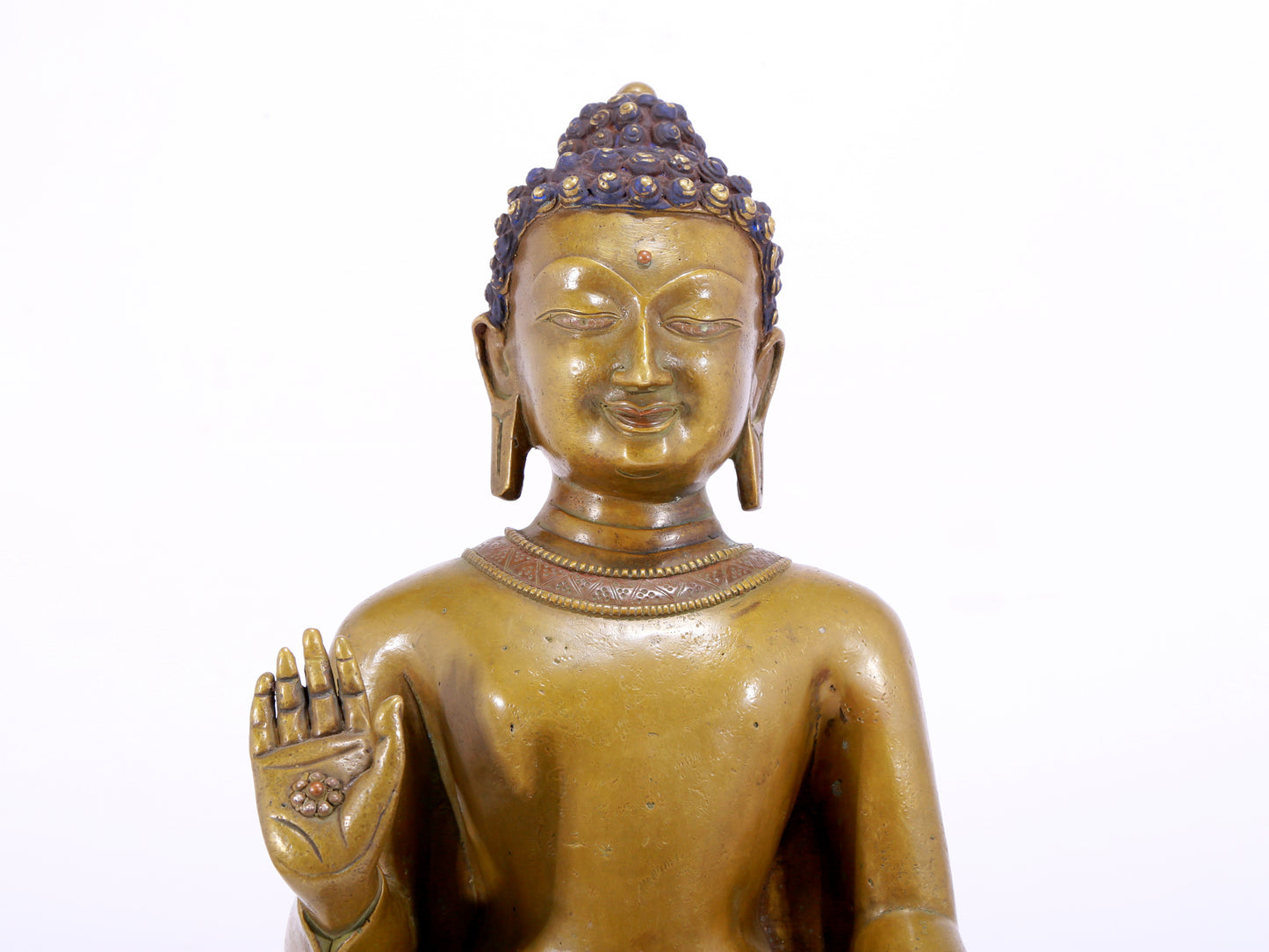 A solemn alloy copper inlaid silver statue of Gautama Buddha