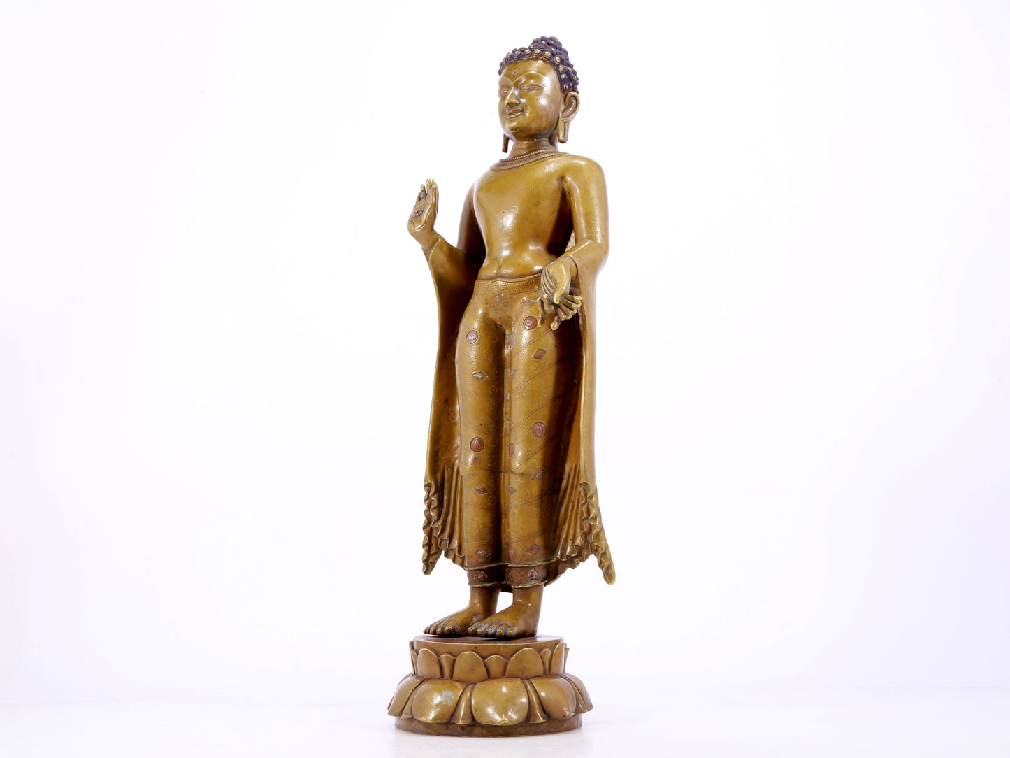 A solemn alloy copper inlaid silver statue of Gautama Buddha