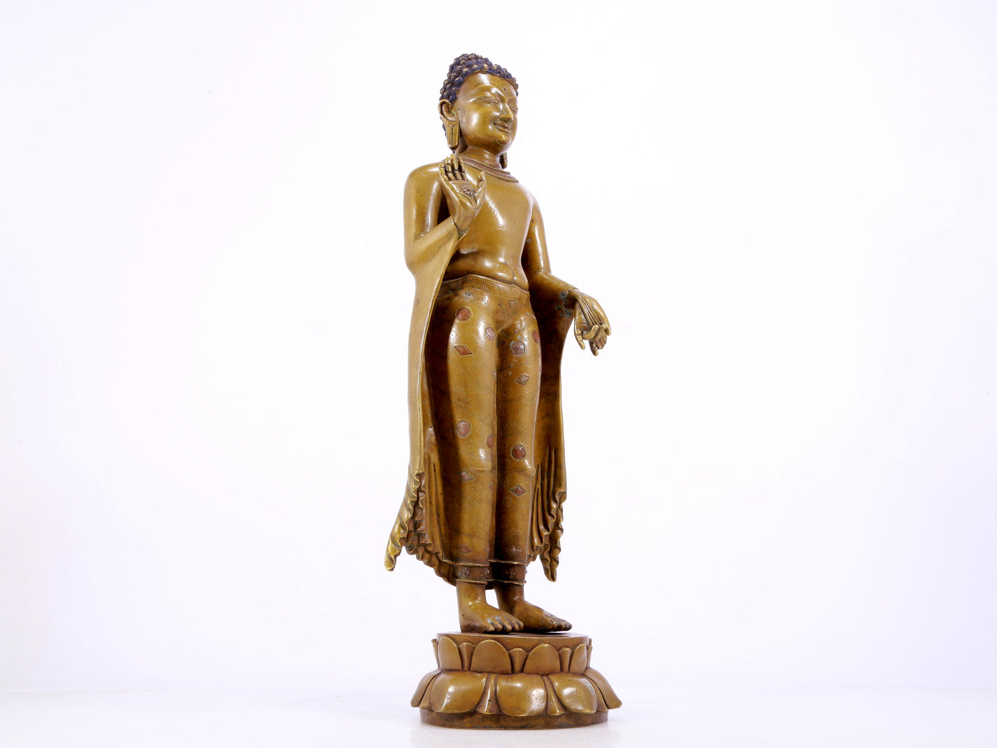 A solemn alloy copper inlaid silver statue of Gautama Buddha