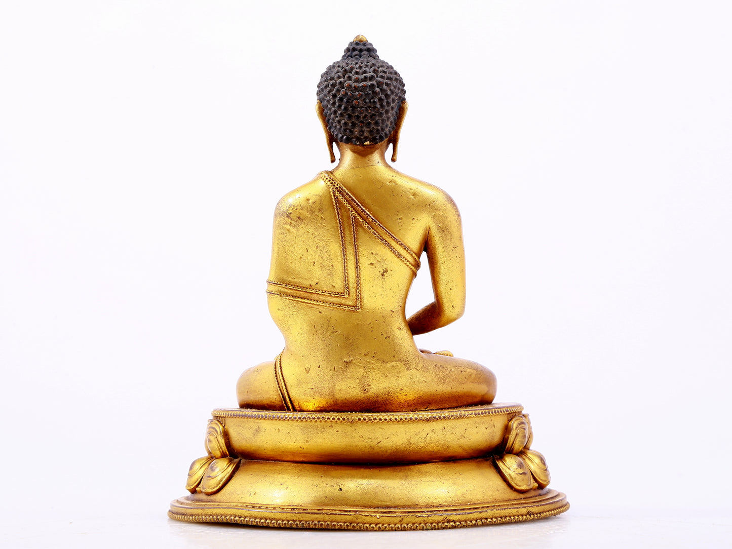 A majestic gilt bronze statue of Sakyamuni