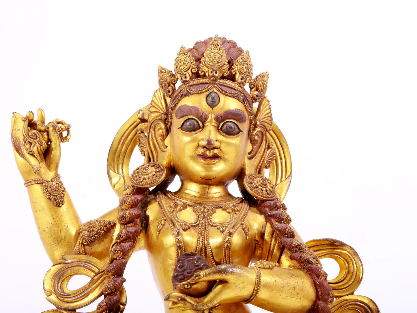 A solemn gilt bronze statue of the God of Wealth