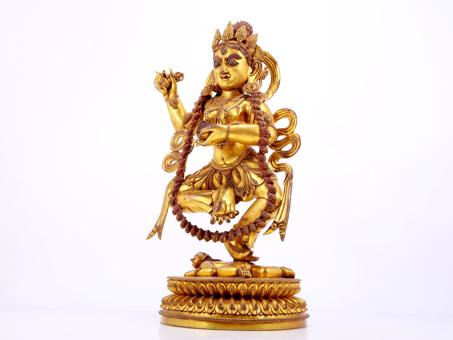 A solemn gilt bronze statue of the God of Wealth