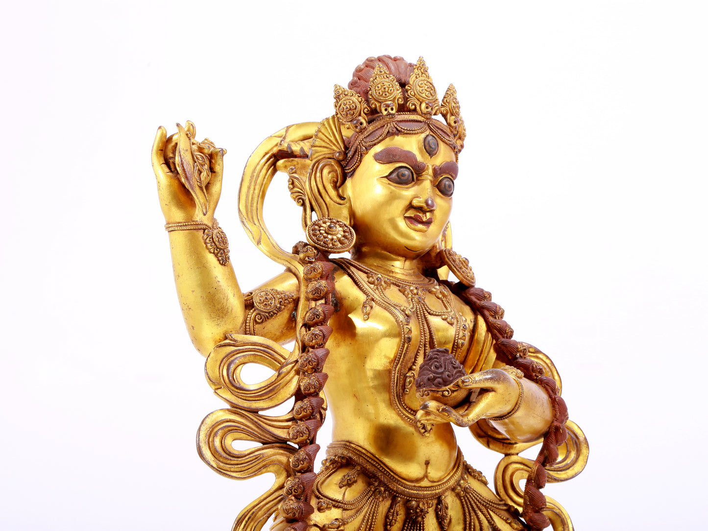 A solemn gilt bronze statue of the God of Wealth