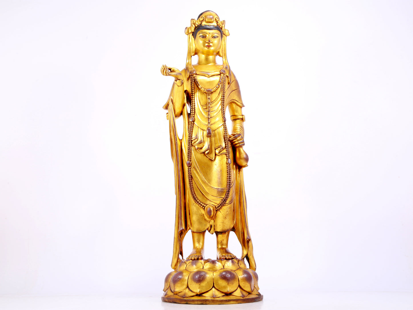 A majestic gilt bronze statue of Guanyin