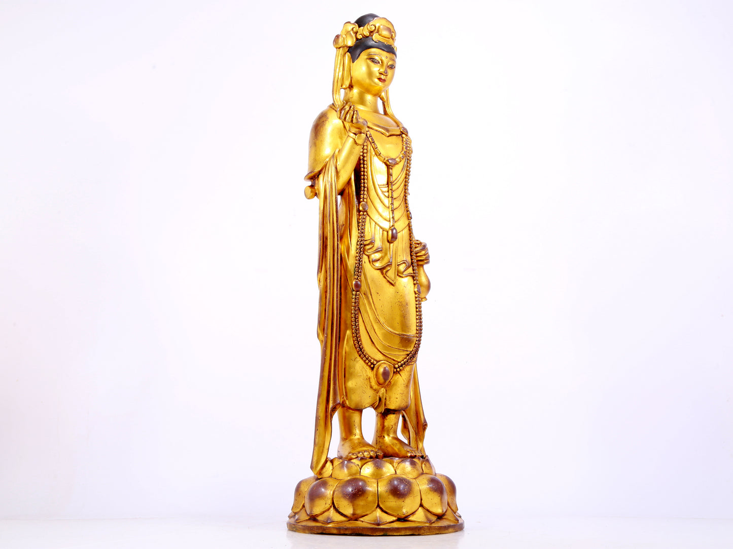 A majestic gilt bronze statue of Guanyin