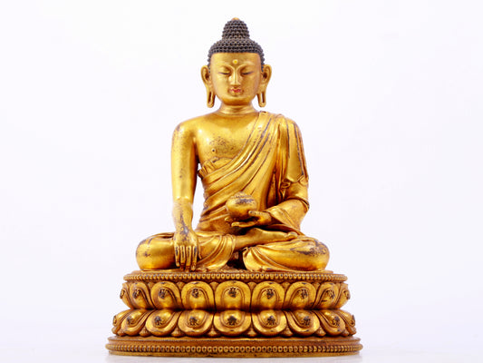 A majestic gilt bronze statue of Sakyamuni