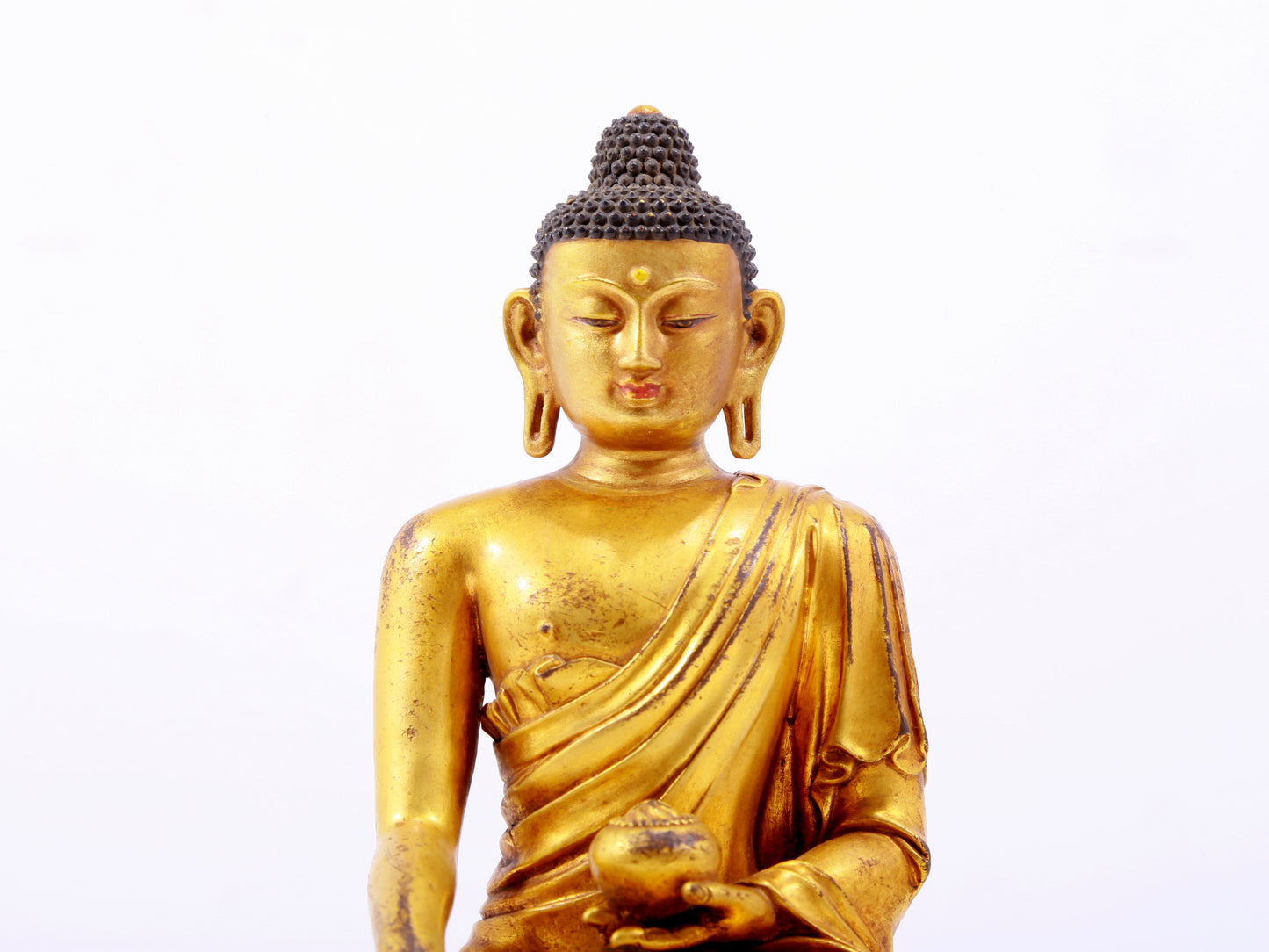 A majestic gilt bronze statue of Sakyamuni