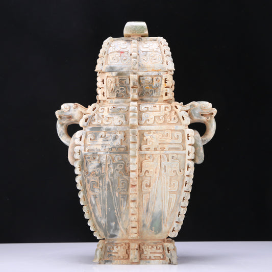 An Archaic Celadon-White Jade 'Auspicious Beast' Vase And Cover