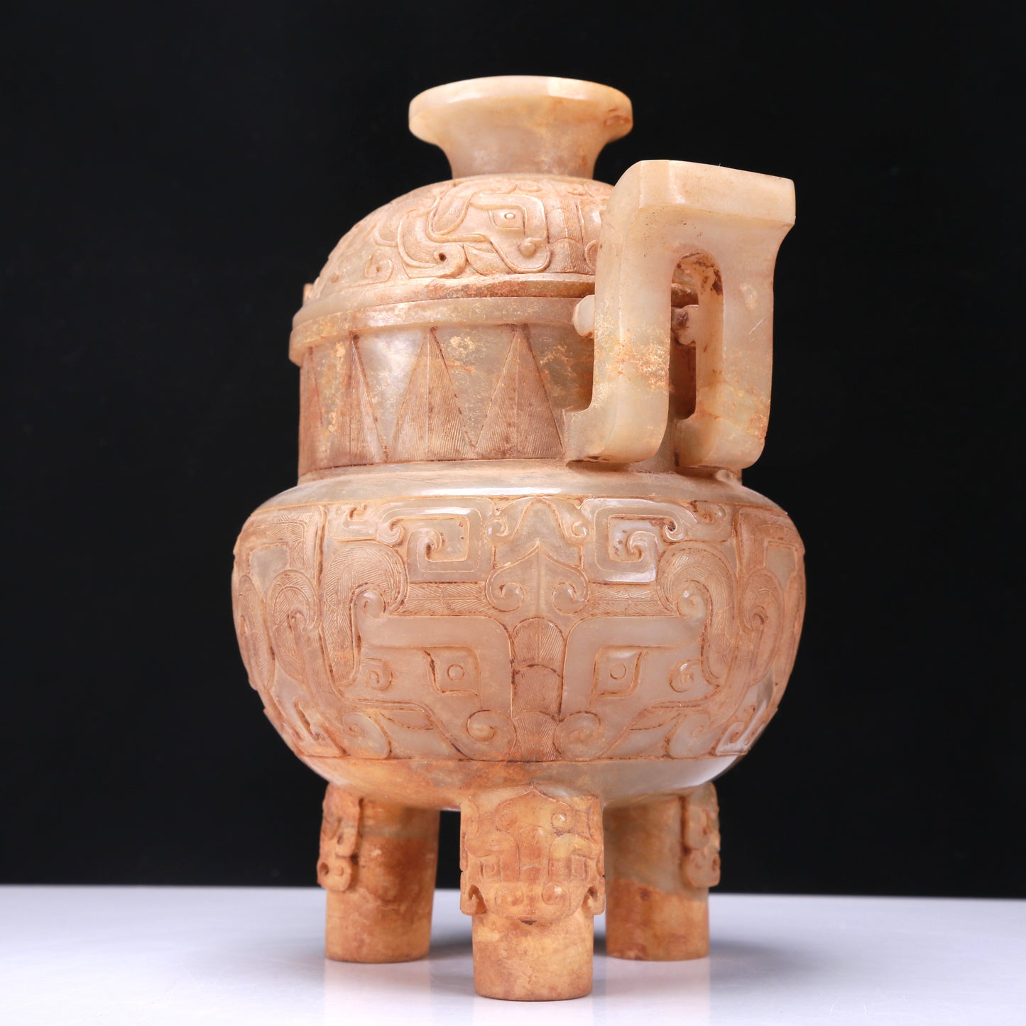 An Archaic White Jade 'Animal Mask' Tripod Censer And Cover