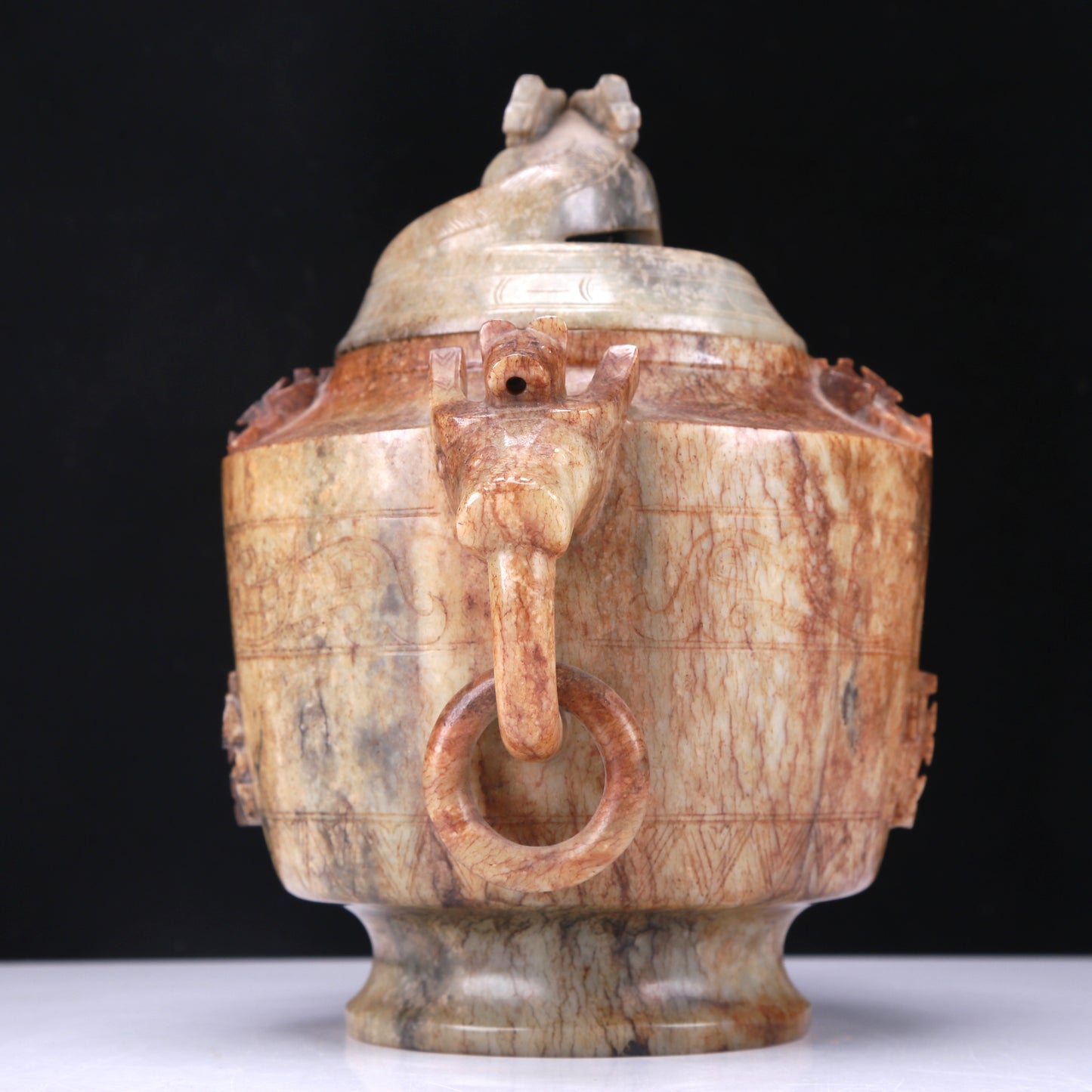 An Archaic White Jade 'Auspicious Beast' Jar And Cover