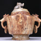 An Archaic White Jade 'Auspicious Beast' Jar And Cover