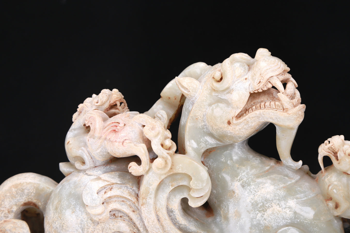 An Elaborate White Jade Dragon Group