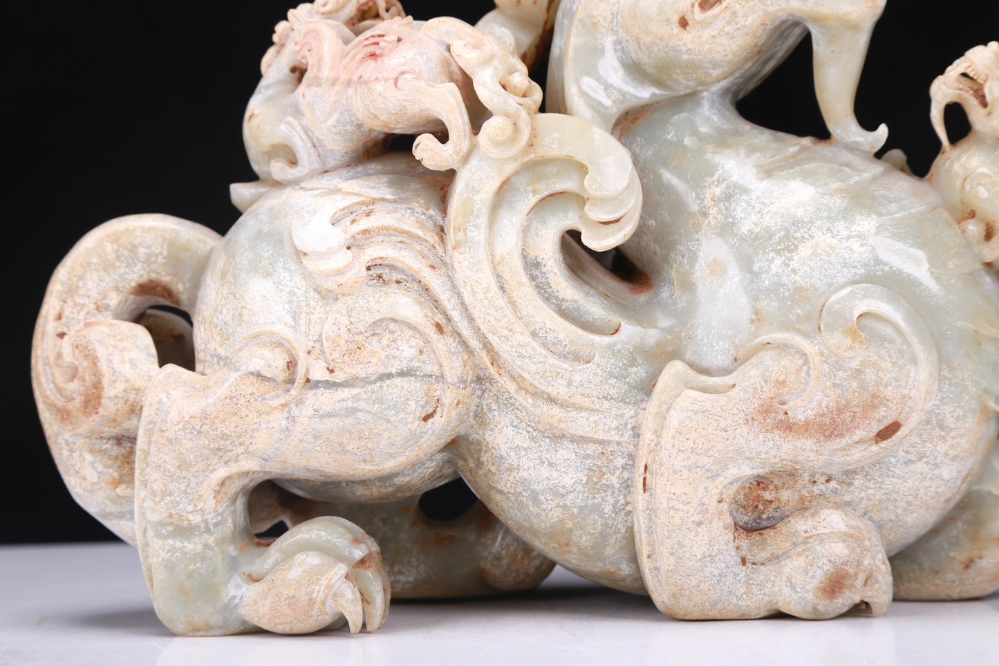 An Elaborate White Jade Dragon Group