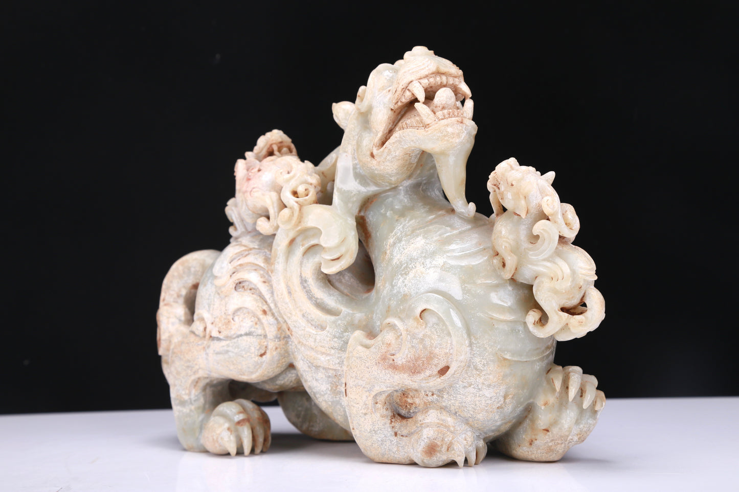 An Elaborate White Jade Dragon Group