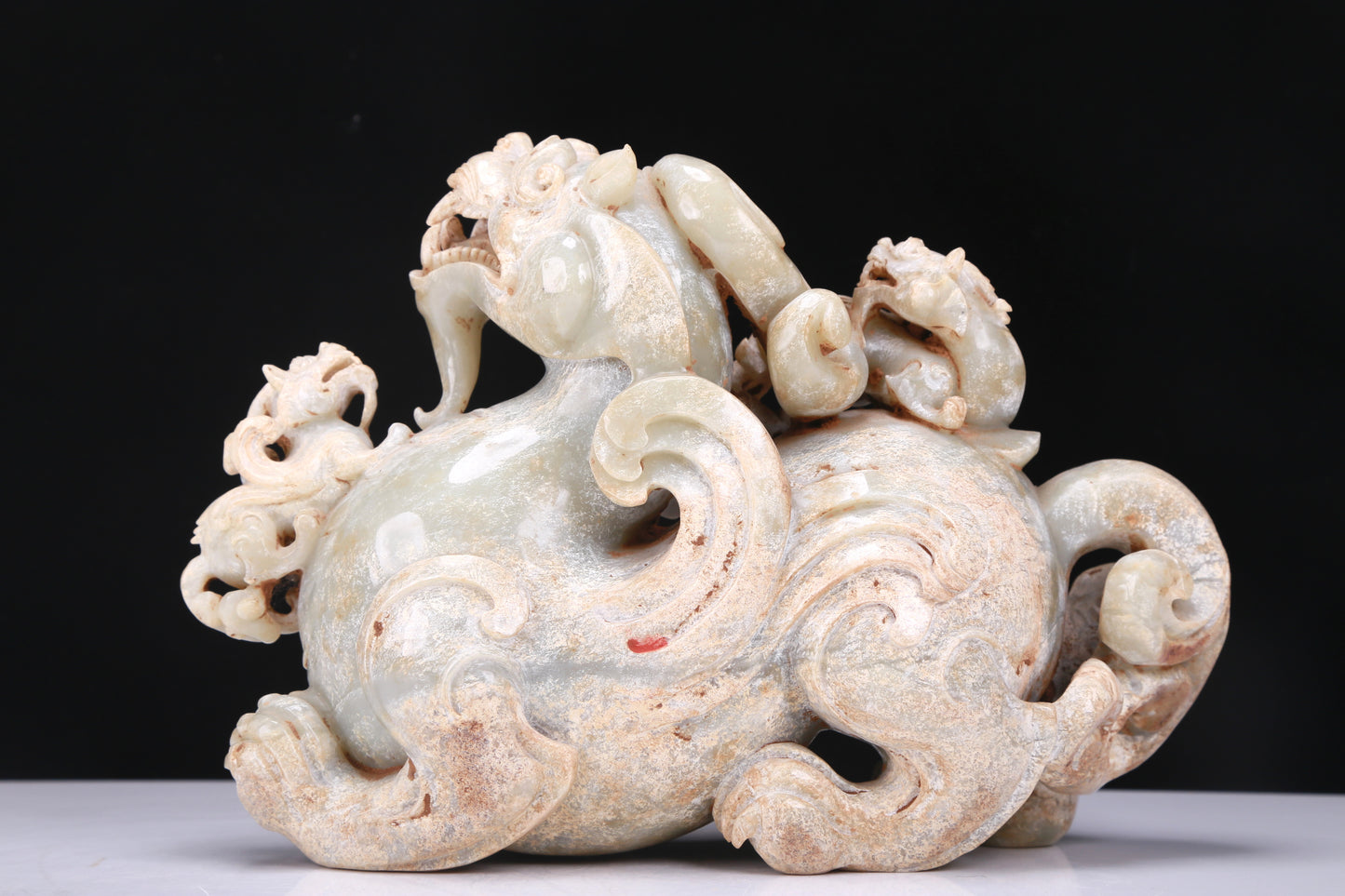 An Elaborate White Jade Dragon Group