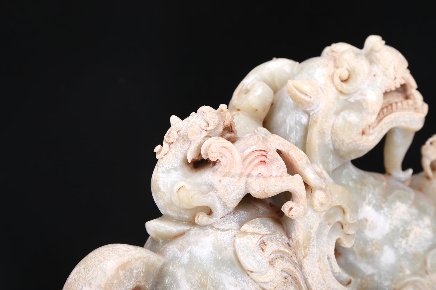 An Elaborate White Jade Dragon Group