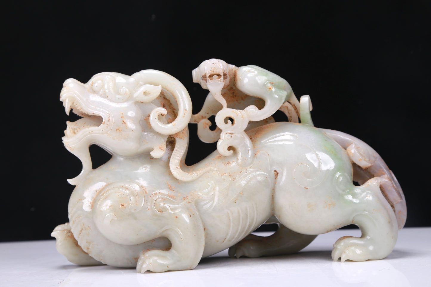 An Elaborate White Jade Auspicious Beast Group