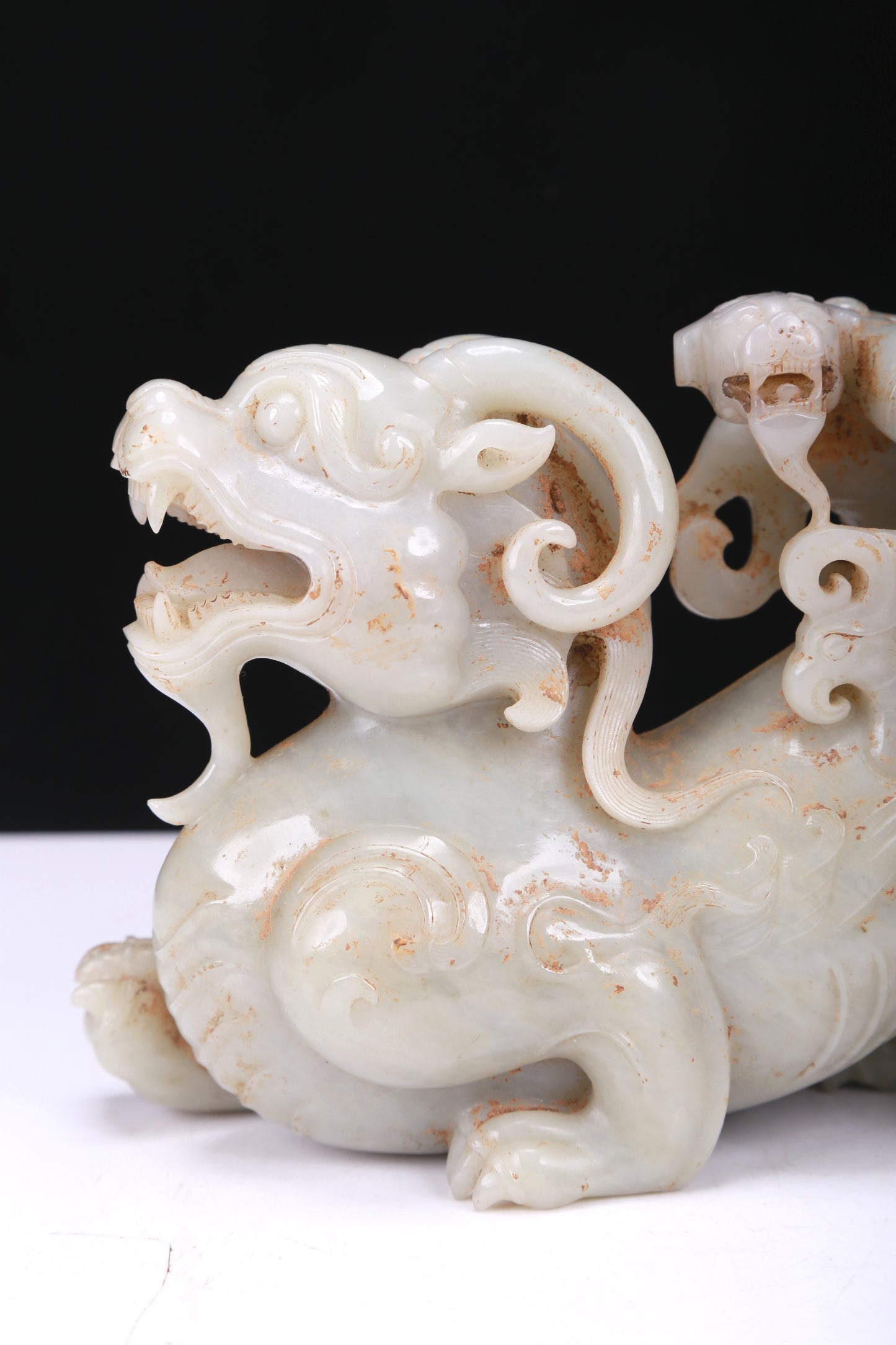 An Elaborate White Jade Auspicious Beast Group