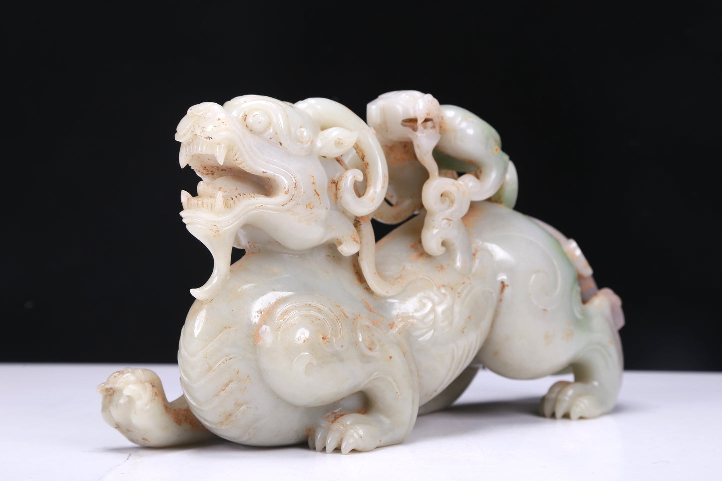 An Elaborate White Jade Auspicious Beast Group