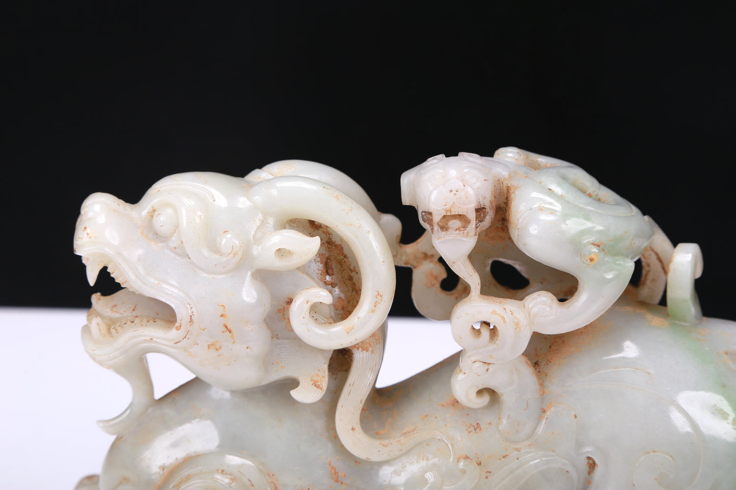 An Elaborate White Jade Auspicious Beast Group