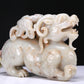 An Elaborate White Jade Auspicious Beast Group