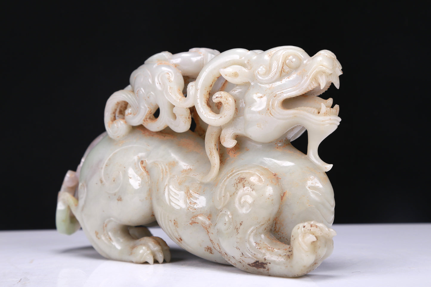 An Elaborate White Jade Auspicious Beast Group