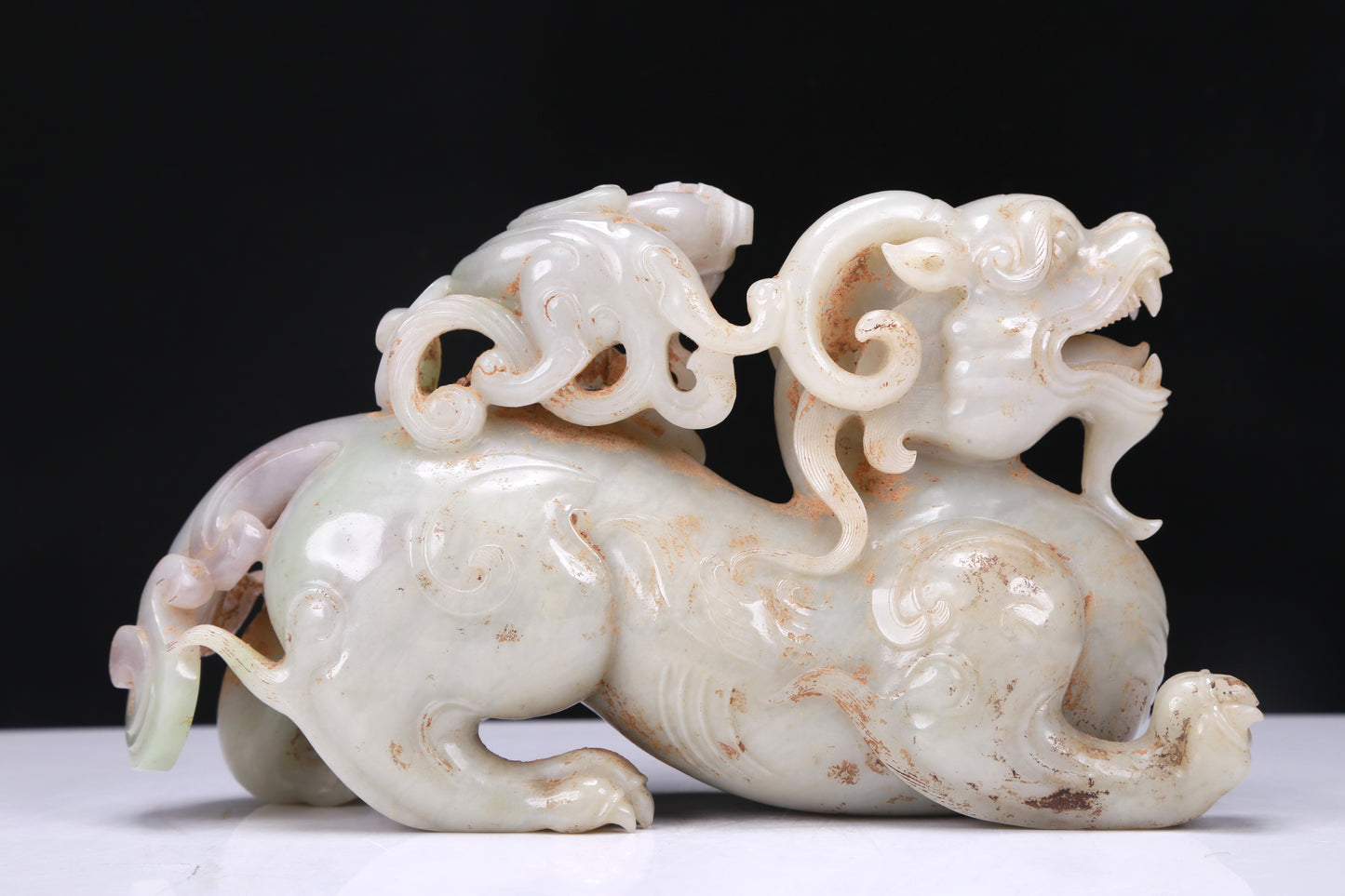 An Elaborate White Jade Auspicious Beast Group