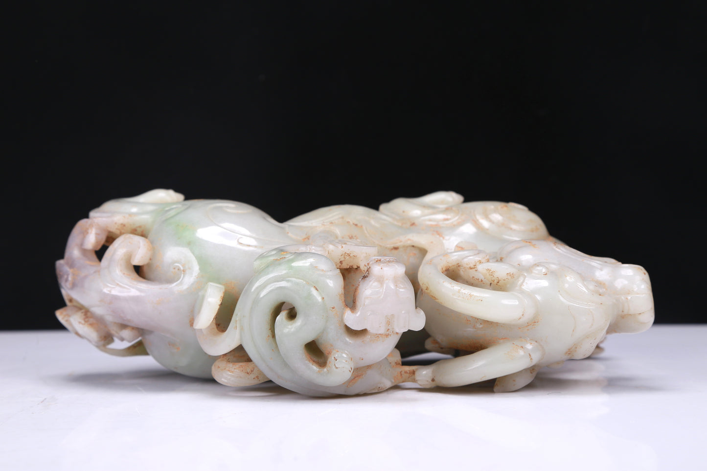 An Elaborate White Jade Auspicious Beast Group