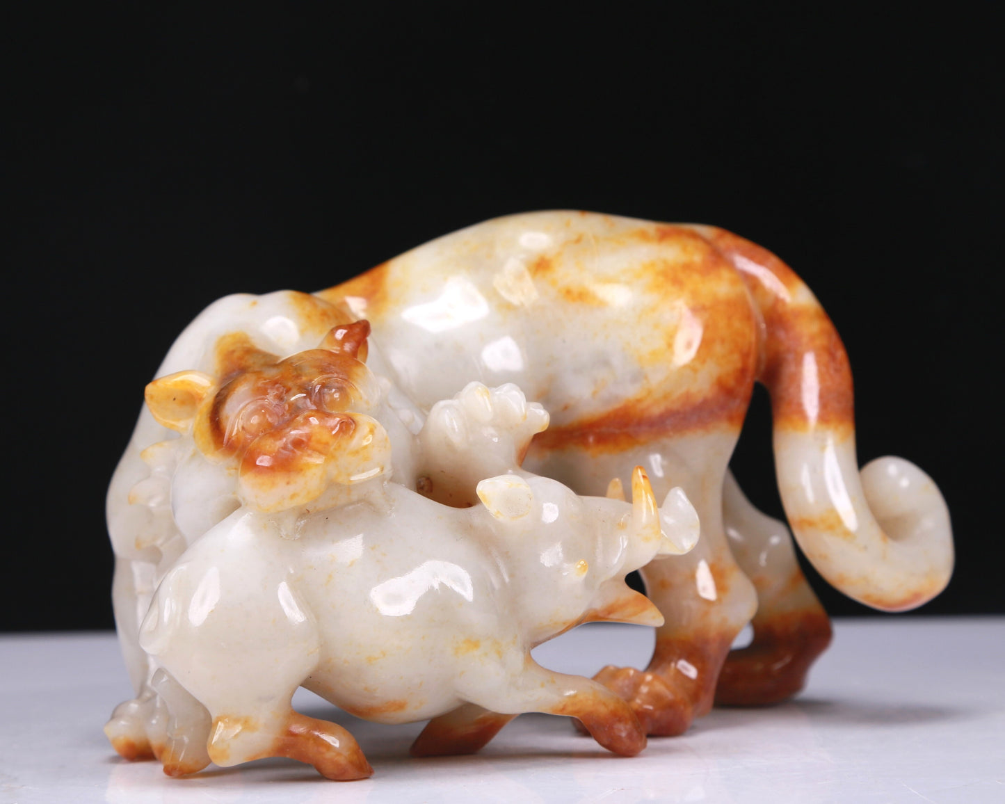 An Elaborate White Jade Auspicious Beast Group