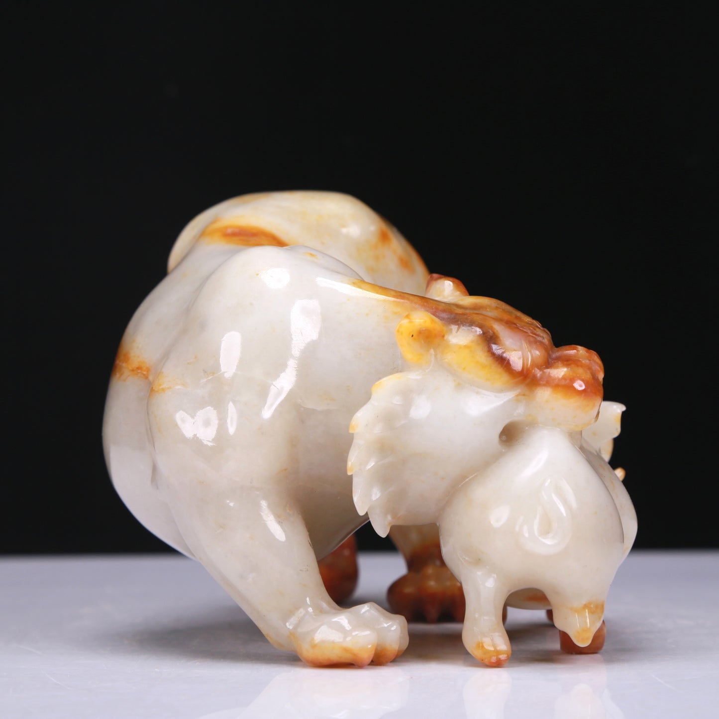 An Elaborate White Jade Auspicious Beast Group