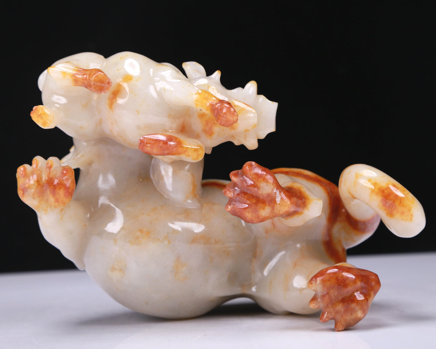 An Elaborate White Jade Auspicious Beast Group