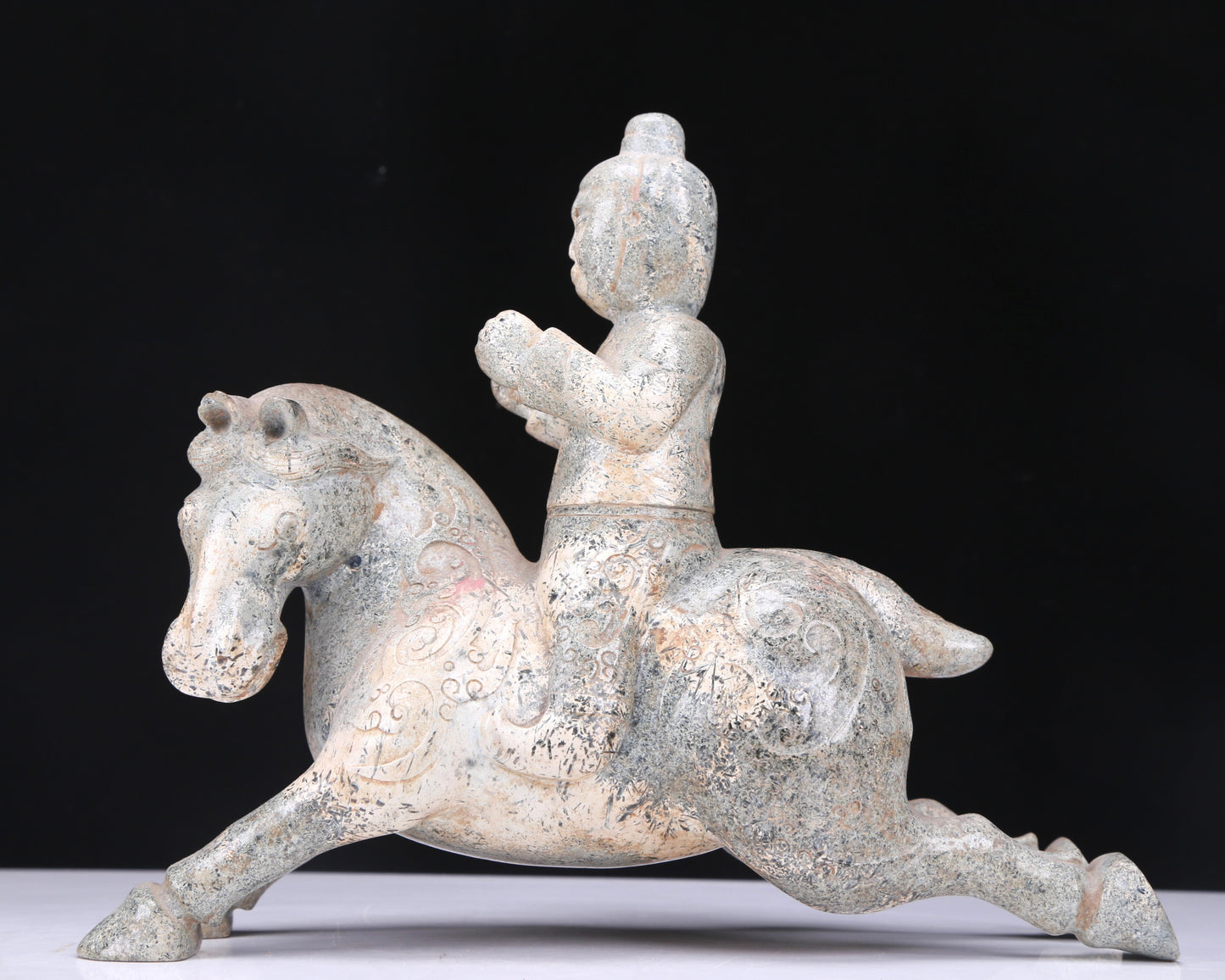 An Excellent White Jade Figure Seated On A Horse