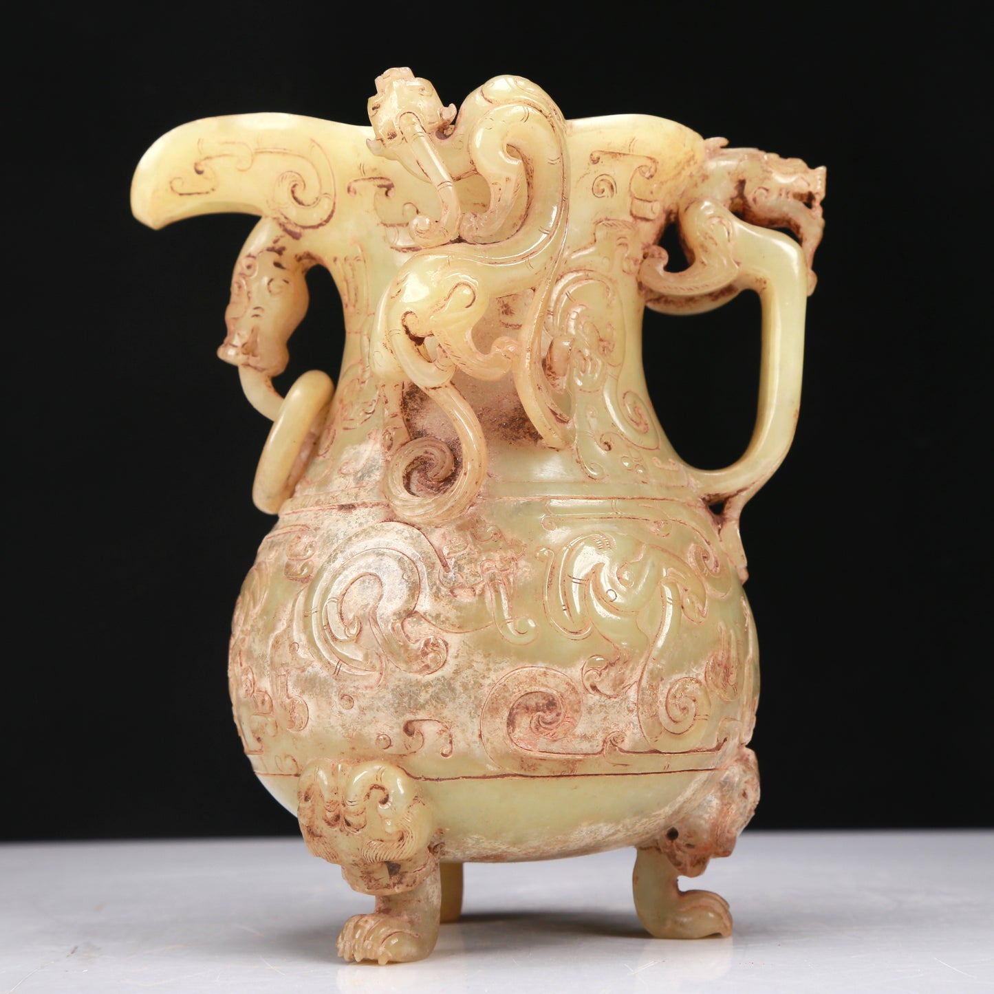 An Elaborate Yellow Jade 'Chi-Dragon' Tripod Ewer With Four 'Chi-Dragon' Cups