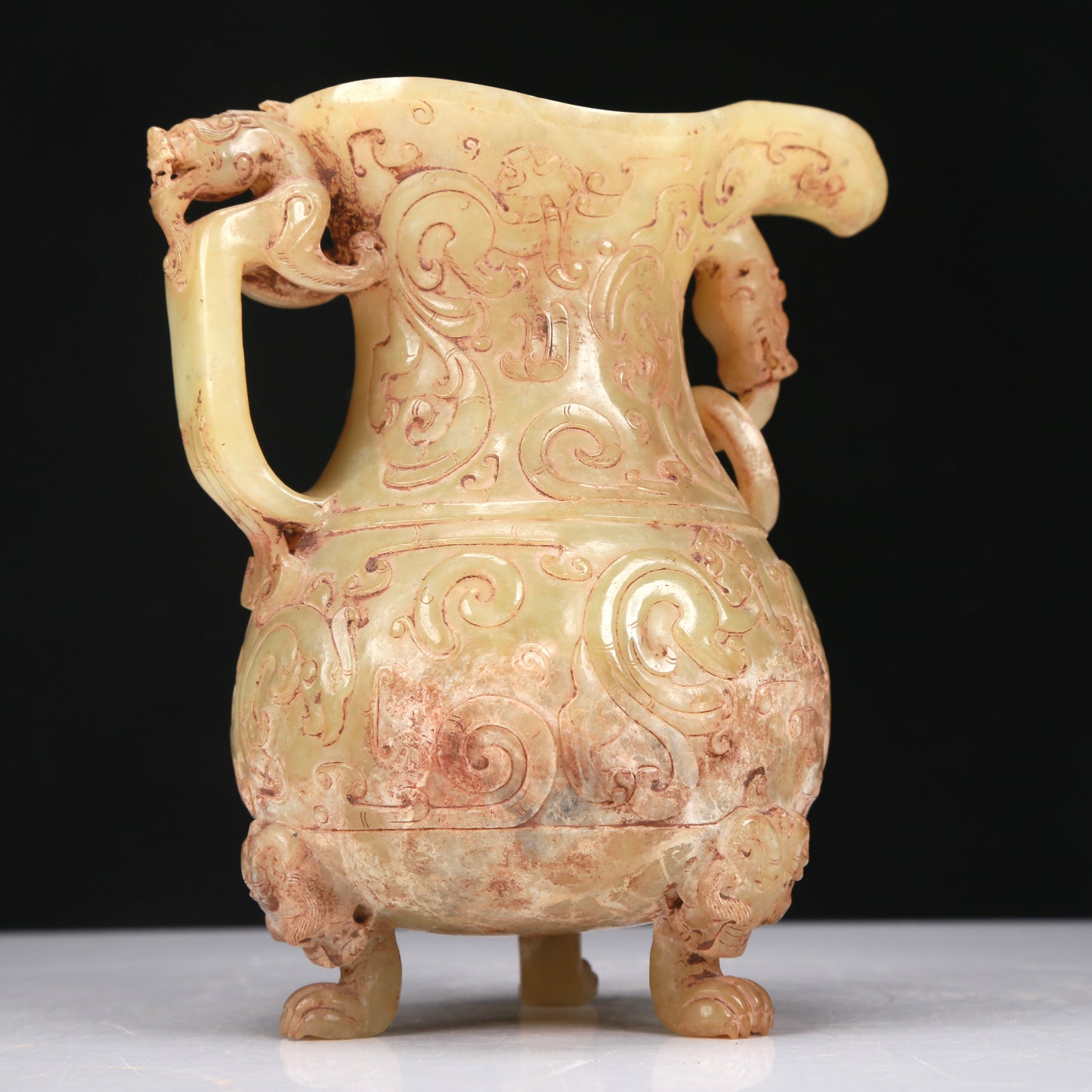 An Elaborate Yellow Jade 'Chi-Dragon' Tripod Ewer With Four 'Chi-Dragon' Cups