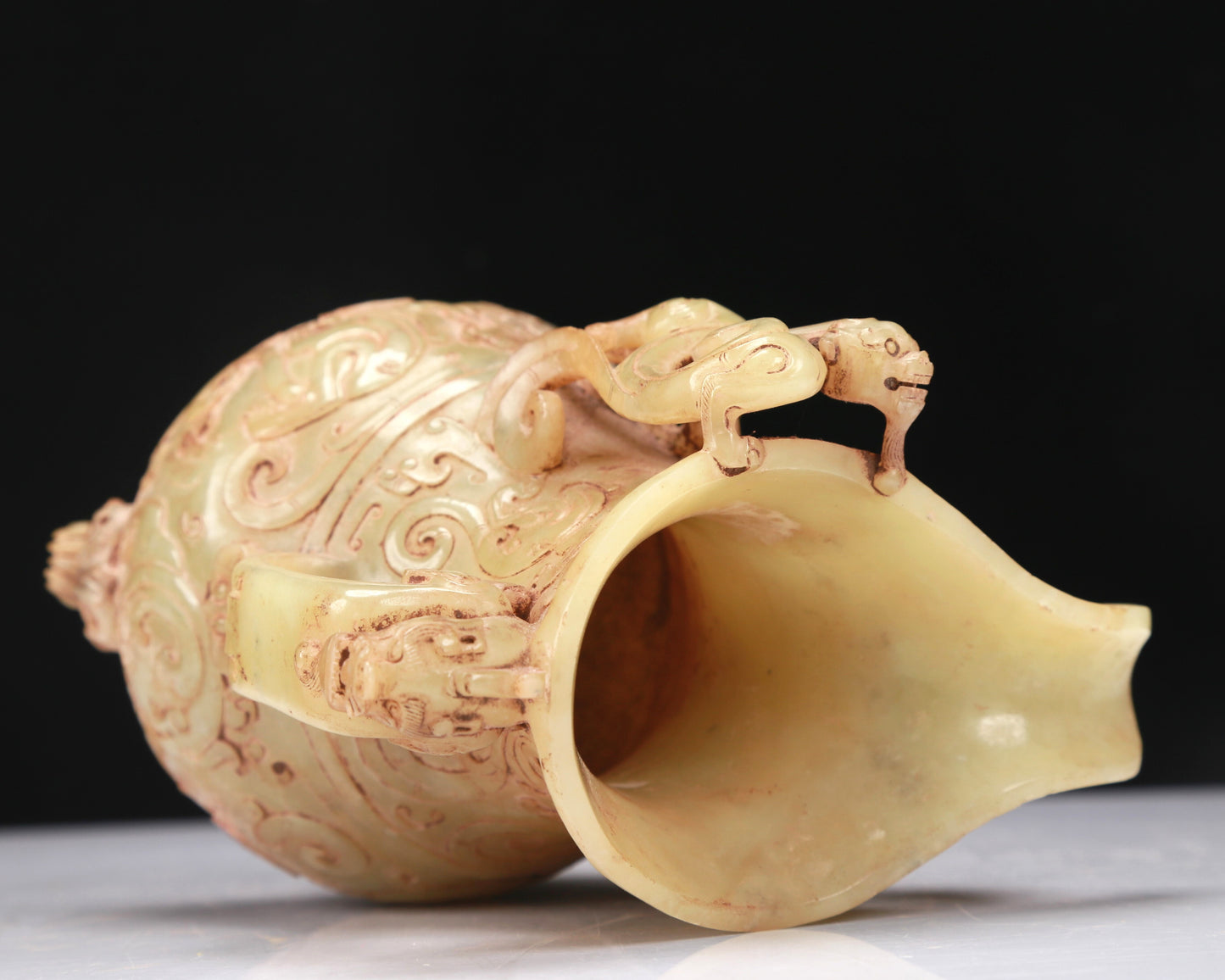 An Elaborate Yellow Jade 'Chi-Dragon' Tripod Ewer With Four 'Chi-Dragon' Cups