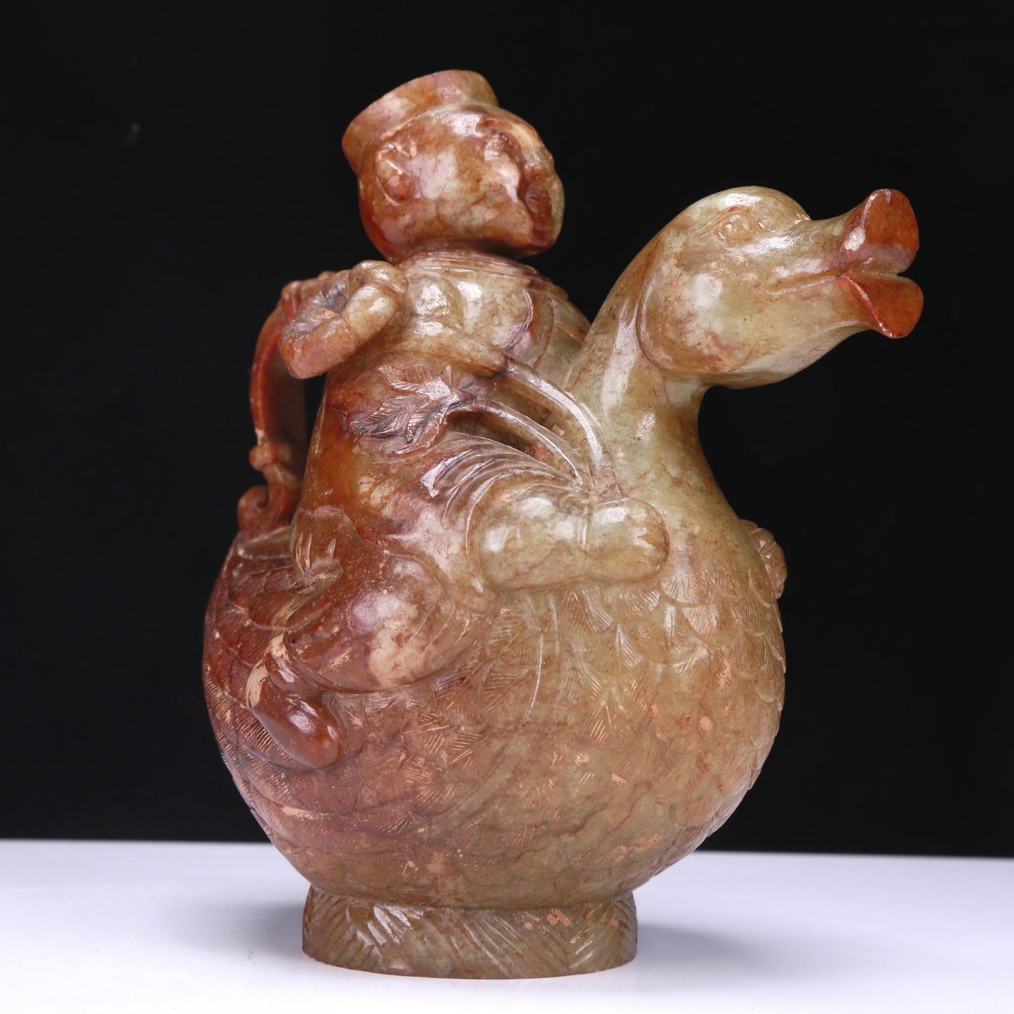 An Excellent White Jade Figure Seated On A Goose