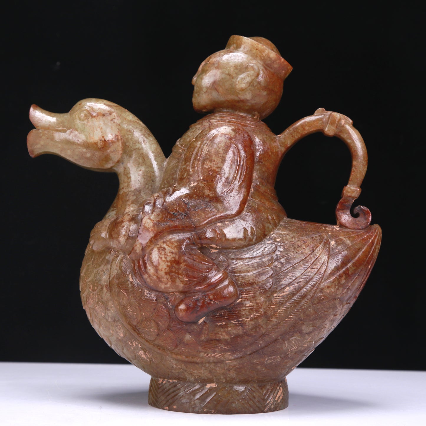 An Excellent White Jade Figure Seated On A Goose