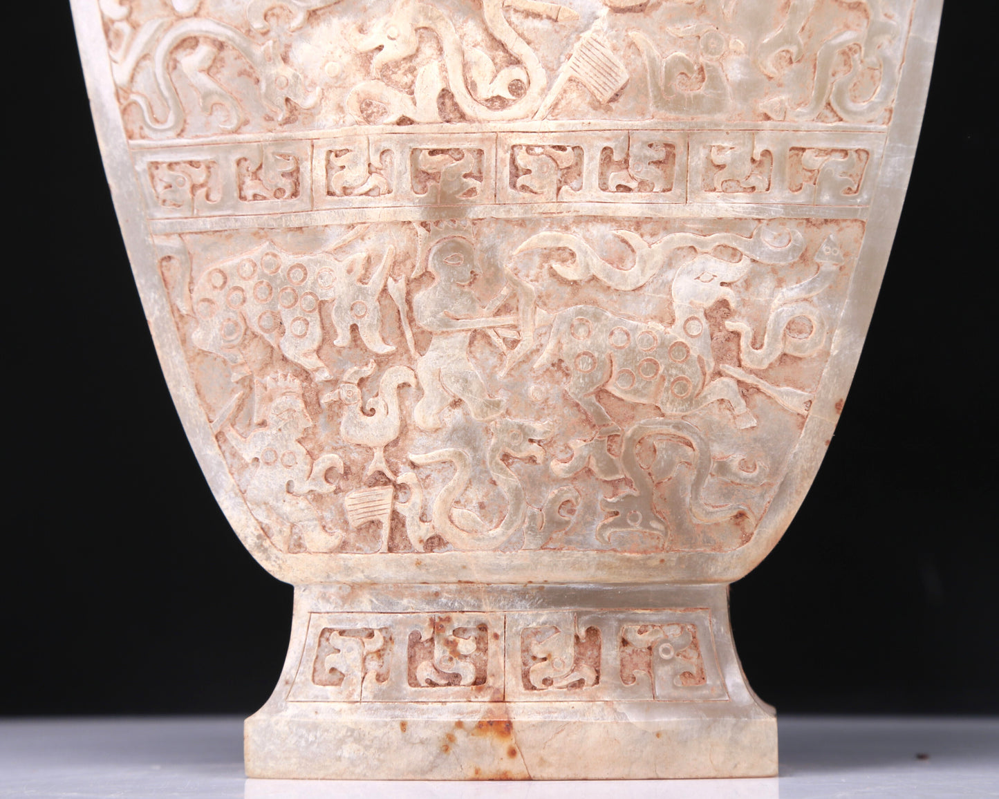 An Elaborate White Jade 'Hunting' Flower-Handled Vase And Cover