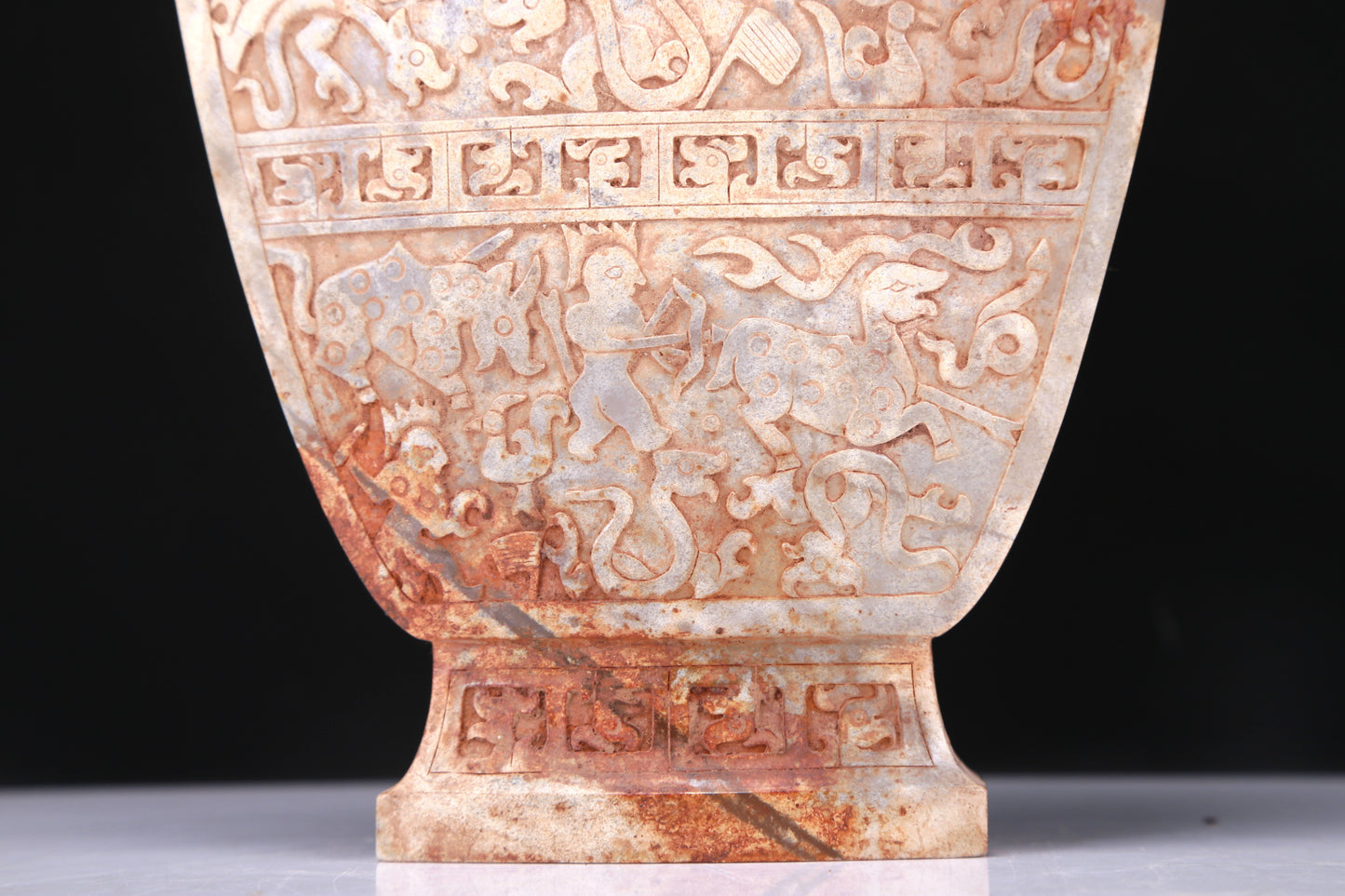 An Elaborate White Jade 'Hunting' Flower-Handled Vase And Cover