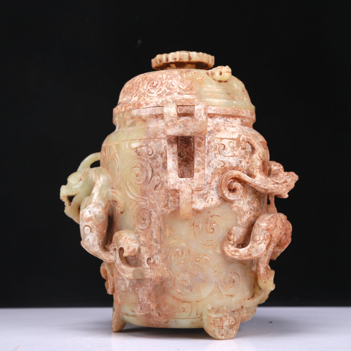 An Elaborate White Jade 'Dragon' Tripod Jar