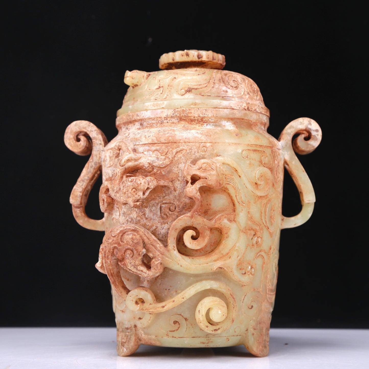 An Elaborate White Jade 'Dragon' Tripod Jar