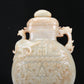 A Fabulous White Jade 'Animal Mask' Dragon& Phoenix-Handled Vase And Cover