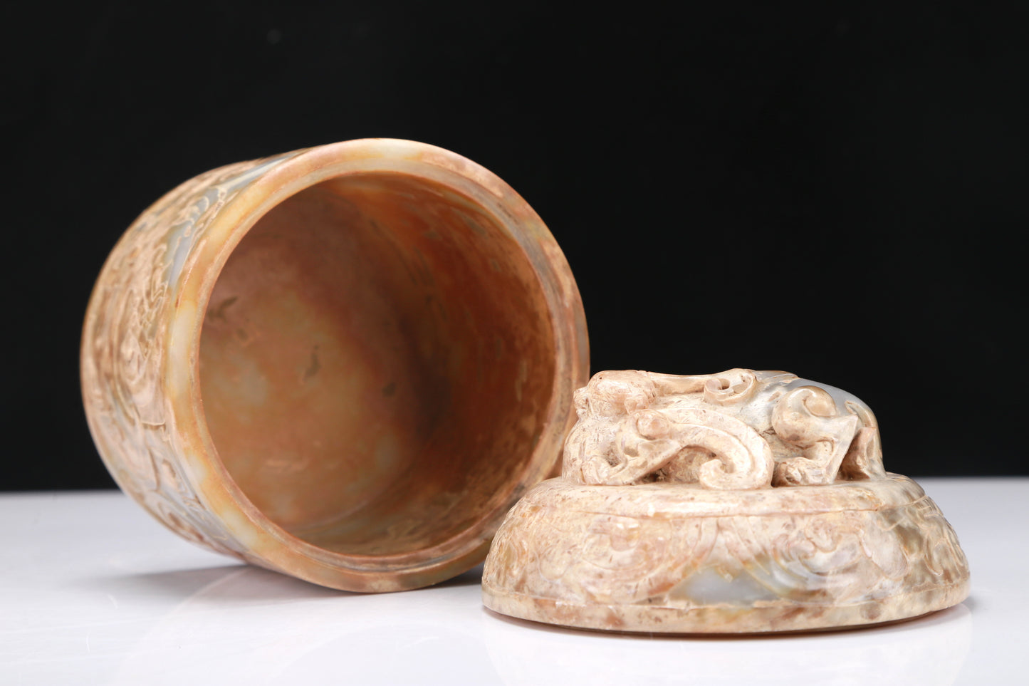 An Archaic White Jade 'Auspicious Beast' Jar And Cover