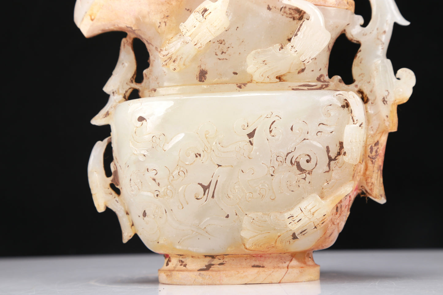 An Archaic White Jade 'Mythical Bird' Ewer